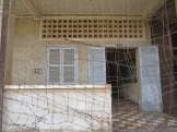 Each large classroom (like the one behind this wire) was converted into many smaller cells.