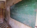 The fact that S-21 was formerly a school is especially perverse. Here's a surviving chalkboard, on which someone appears to have written rules for student conduct in French. ("Il est absolument interdit de faire du bruit.")