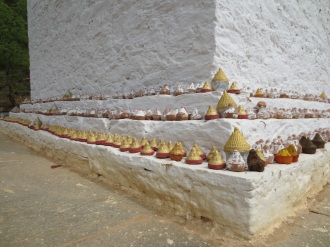 Mini stupas arranged on a larger stupa.